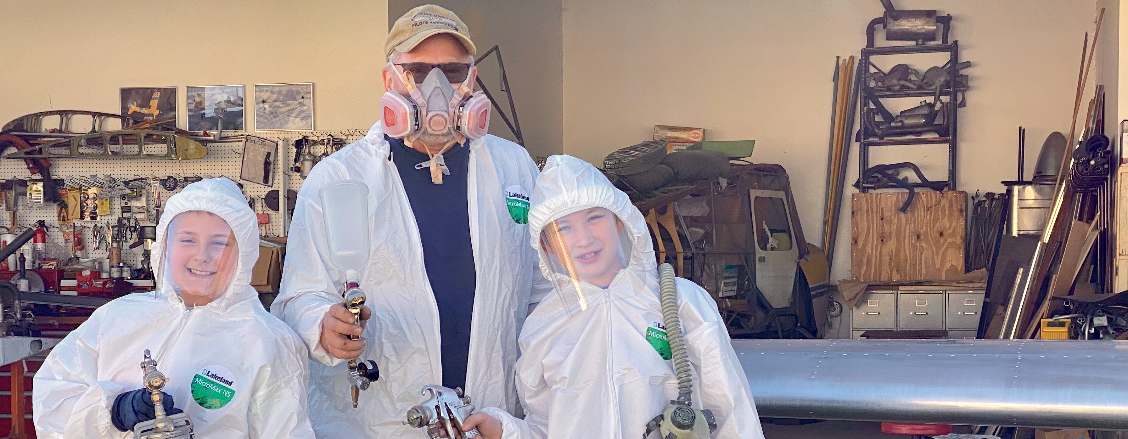 Chapter members working on an aircraft project in the hangar